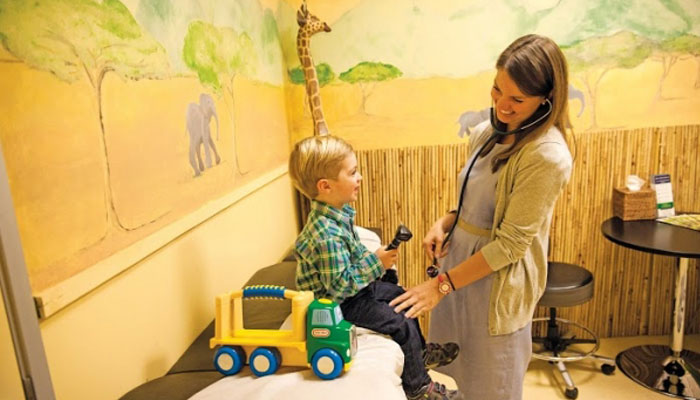 Dr. Jacqueline Bors with child patient