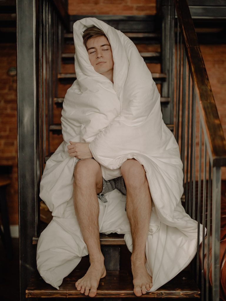 Man with white blanket