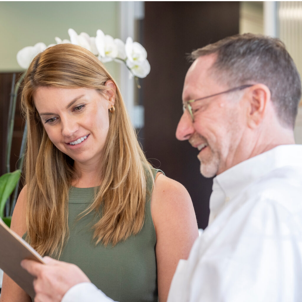 Dr. Eric Concierge doctor consulting with patient in a modern family healthcare clinic