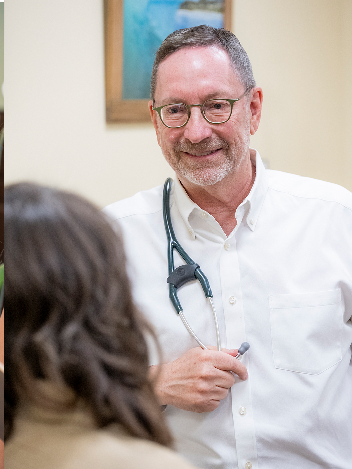 Dr. Eric conversing